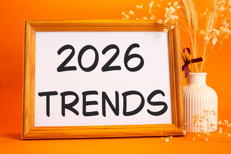 2026 Trends symbol. Concept words 2026 Trends on beautiful wooden picture frame. Beautiful orange...