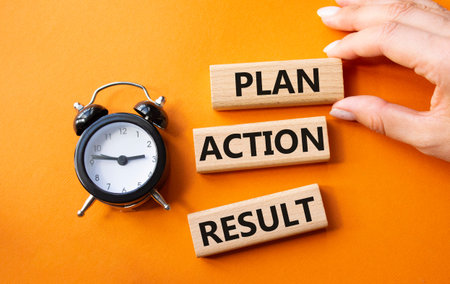 Plan Action Result symbol. Concept words Plan Action Result on wooden blocks. Businessman hand....