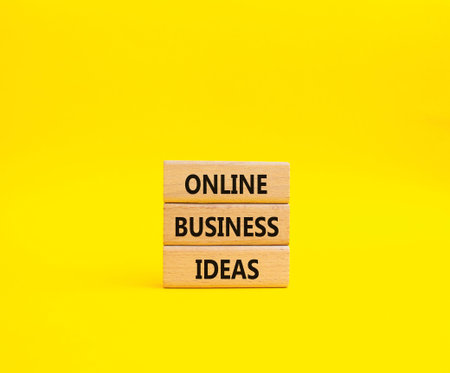Online Business Ideas symbol. Wooden blocks with words Online Business Ideas. Beautiful yellow background. Business and Online Business Ideas concept. Copy space.の写真素材