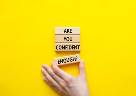 Confidence symbol. Concept words Are you confident enough wooden blocks. Beautiful bright yellow...