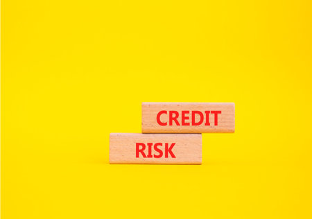 Credit Risk symbol. Wooden blocks with words Credit Risk. Beautiful yellow background. Business and...