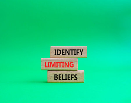 Limiting Beliefs symbol. Concept word Identify Limiting Beliefs on wooden blocks. Beautiful green...