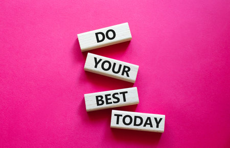 Do Your Best Today symbol. Concept words Do Your Best Today on wooden blocks. Beautiful bright pink...
