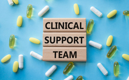 Clinical Support Team symbol. Concept words Clinical Support Team on wooden blocks. Beautiful blue...