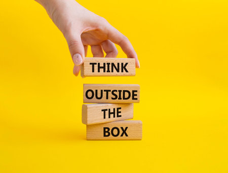 Wooden blocks with words. Businessman hand. Beautiful yellow background. Business and concept. Copy...