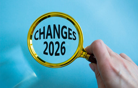 Changes 2026 symbol. Magnifying Glass with words Changes 2026. Beautiful blue background....