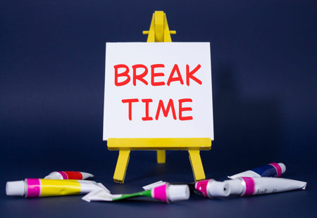 Break Time symbol. Concept word Break Time on wooden blocks. Beautiful deep blue background with...