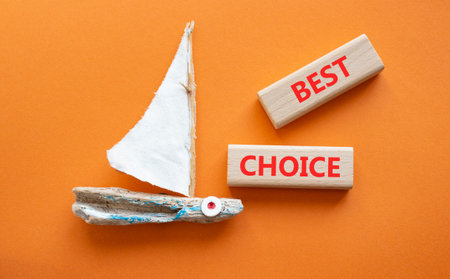 BEST CHOICE symbol. Concept word BEST CHOICE on wooden blocks. Beautiful orange background with...