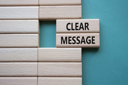 CLEAR MESSAGE symbol. Concept word CLEAR MESSAGE on wooden blocks. Beautiful gray green background....