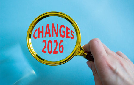 Changes 2026 symbol. Magnifying Glass with words Changes 2026. Beautiful blue background....