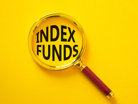 Index Funds symbol. Magnifying Glass with words Index Funds. Beautiful yellow background. Business...
