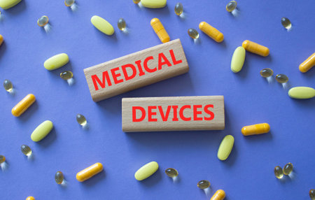 MEDICAL DEVICES symbol. Concept word MEDICAL DEVICES on wooden blocks. Beautiful purple background...