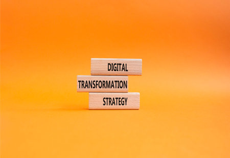 Digital Transformation Strategy symbol. Concept word Digital Transformation Strategy on wooden...