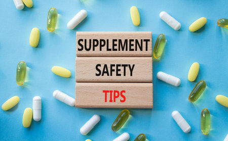 SUPPLEMENT SAFETY TIPS symbol. Concept words SUPPLEMENT SAFETY TIPS on wooden blocks. Beautiful blue...