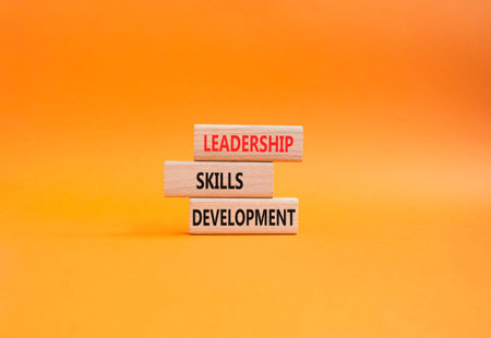 Leadership skills development symbol. Concept word Leadership skills development on wooden blocks....