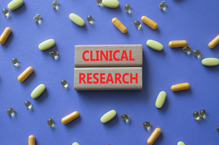 CLINICAL RESEARCH symbol. Concept word CLINICAL RESEARCH on wooden blocks. Beautiful purple...