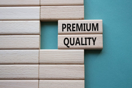 PREMIUM QUALITY symbol. Concept word PREMIUM QUALITY on wooden blocks. Beautiful grey green...