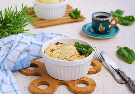 Portioned traditional Italian Easter cake or tart with spinach, ricotta and whole eggs. Italian...