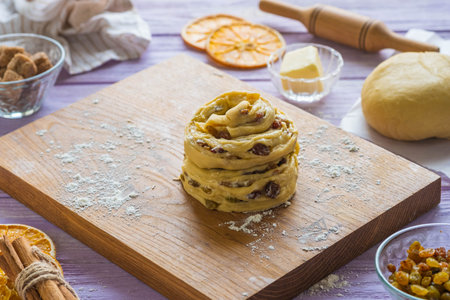 Step-by-step cooking of kraffin ( cruffin), yeast Easter cake with raisins. Step five, shaped...