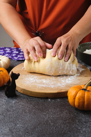 Step by step recipe for pumpkin bread shaped like a Halloween jack-o'-lantern on a dark concrete...