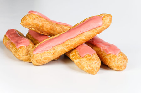 Eclairs on white background on white background