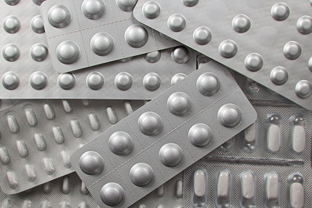 background of drugs in silver packの写真素材