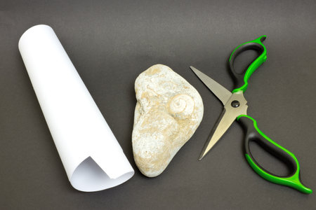 Scissors, paper, stone  as a game, isolated on black background 
の写真素材