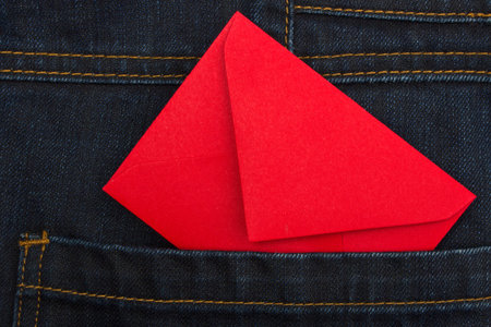 Red envelope in jeans pocket 