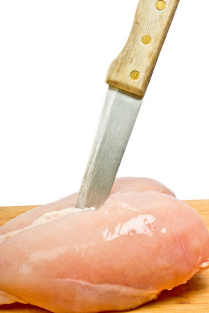 Fresh raw chicken fillets isolated on white backgroundの写真素材