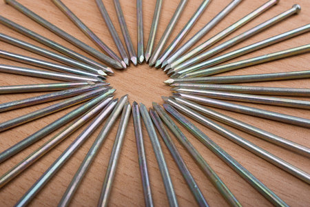 Nails on wooden background, close upの写真素材