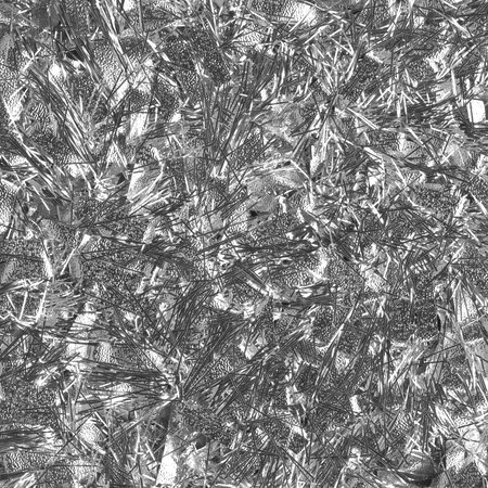 Silver Christmas tinsel background, closeup