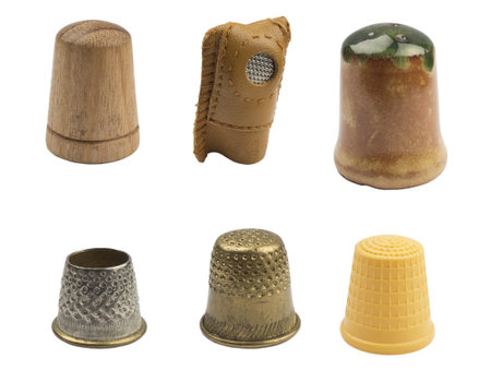 sewing thimbles isolated on white の写真素材
