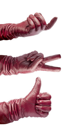 Closeup of hands in red gloves on white backgroundの写真素材