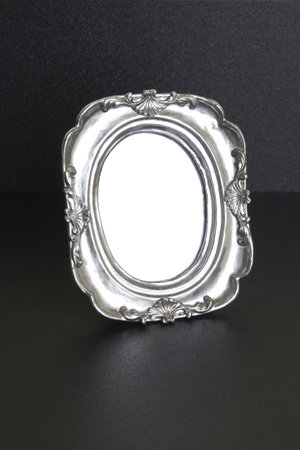 silver frame on a black background, silver frame on the black tableの写真素材