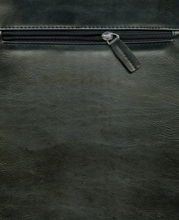Zipper on a leather bag, black leather textureの写真素材