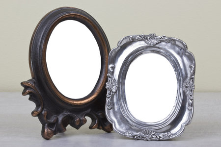 blank photo frames on the table の写真素材