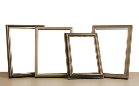 blank photo frames on the table の写真素材