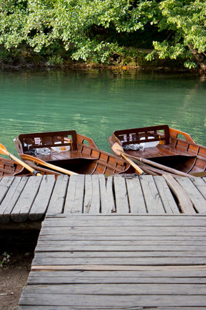 Wooden boats on water  in Plitvice Lakes National Park, Croatia の写真素材