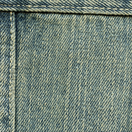 old and worn blue denim texture, seamsの写真素材