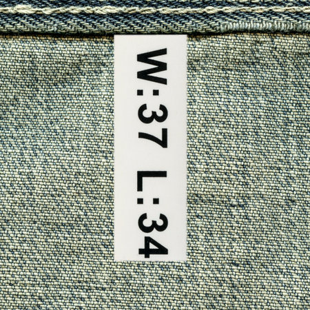 texture of old blue jeans wrong side, seam, tagの写真素材