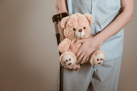 patient on crutches with a children's toy.の写真素材