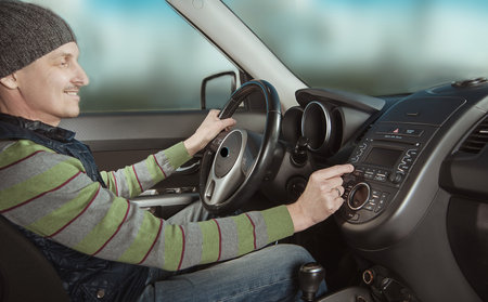 man behind the wheel of a new carの写真素材