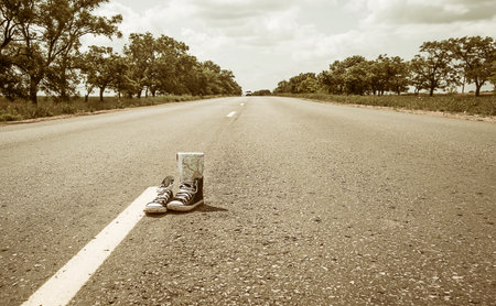 sneakers on the road. road. journeyの写真素材