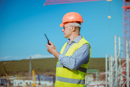 Portrait of a male engineer on a construction site backgroundの写真素材