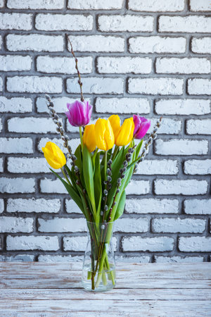 vase with tulips and pussy willowの写真素材