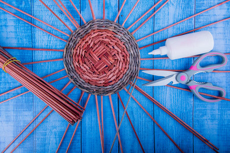 handmade, weaving baskets from newspaper tubesの写真素材