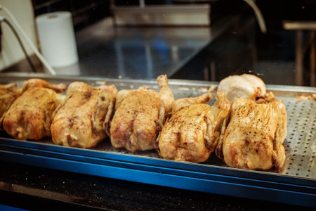 rotisserie  grill chicken on a supermarket counter, grilled chickenの写真素材