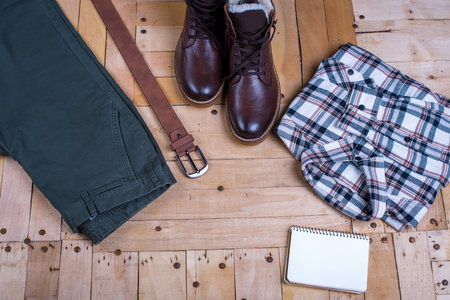 men's stylish winter clothes and Blank white notebook . winter fashionの写真素材