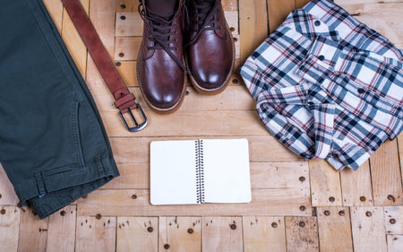 men's stylish winter clothes and Blank white notebook . winter fashionの写真素材