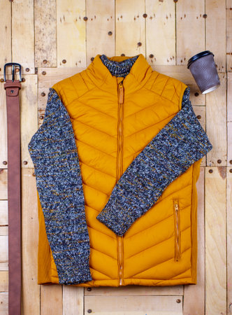 Winter men's clothes and accessories on a wooden background.の写真素材